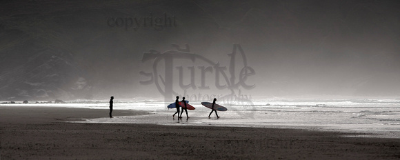 Hell's Mouth, Porth Neigwl with silhouetted surfers. SARPAN